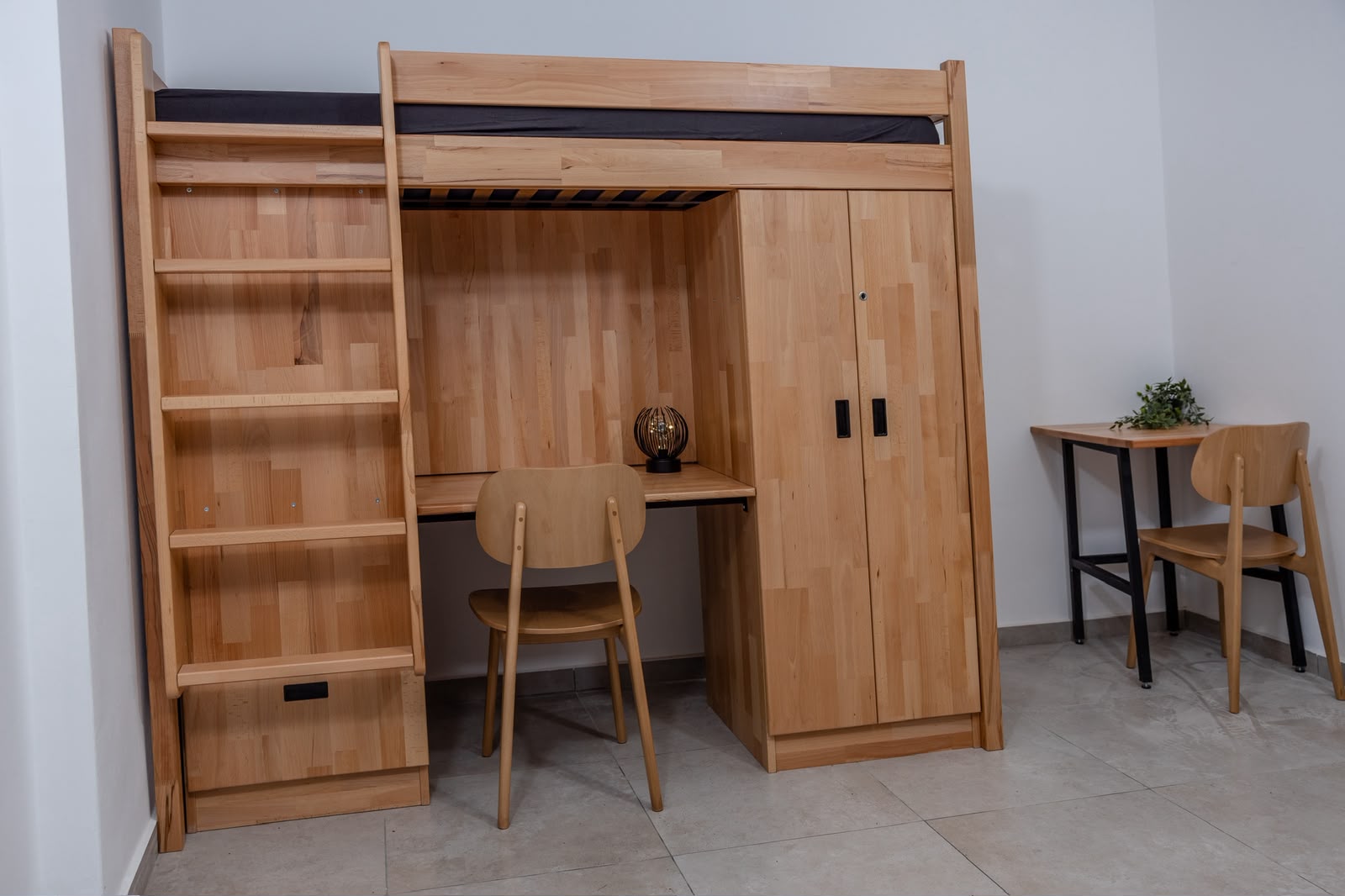 Integrated loft bed, desk, shelving and wardrobe system in natural wood