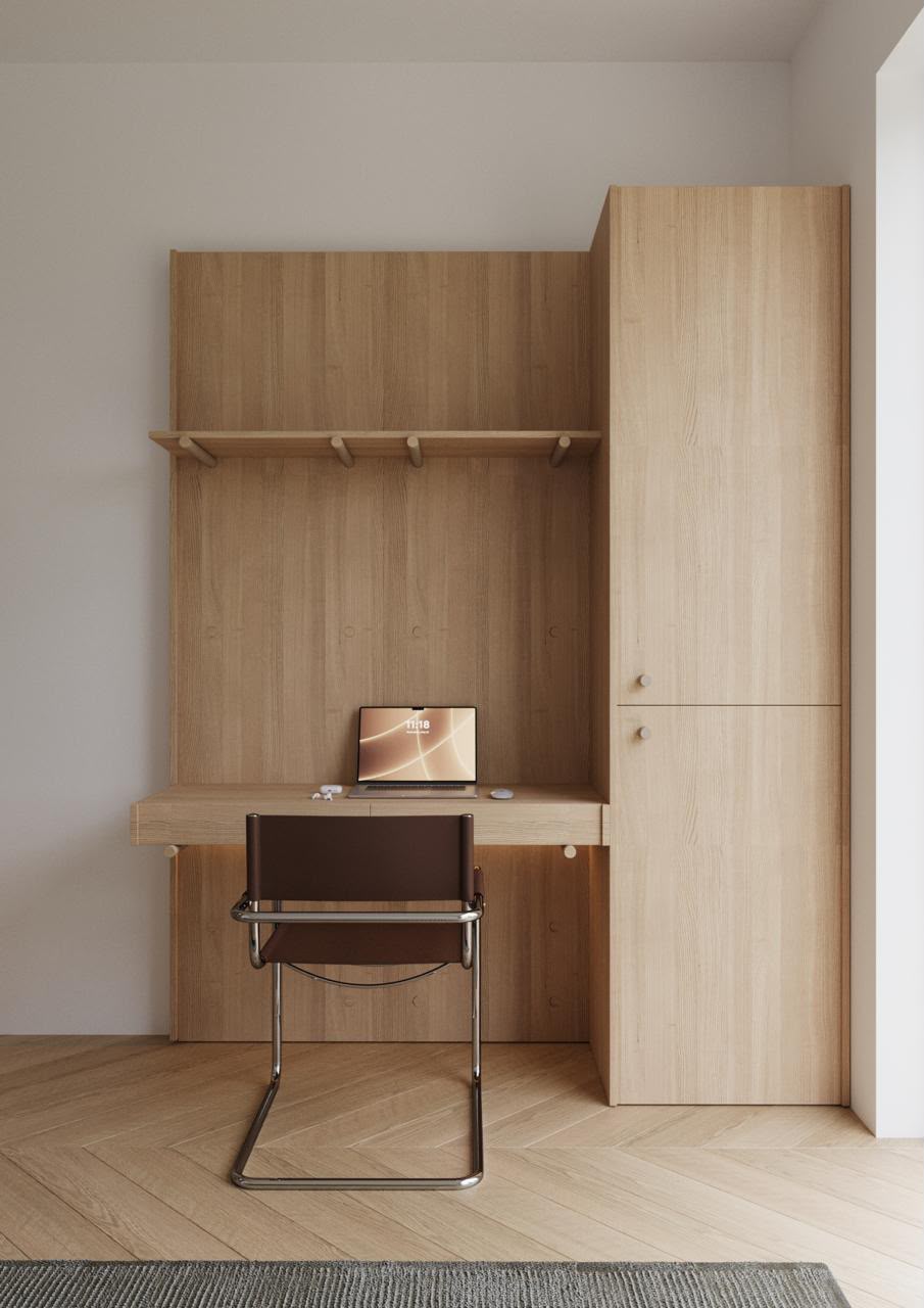 Light wood study desk and wardrobe in a compact dormitory room