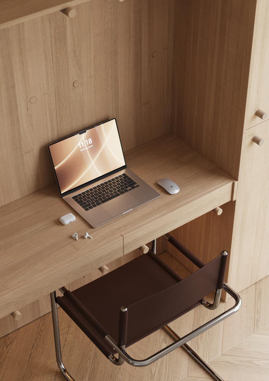 Compact light wood study desk beside a student wardrobe