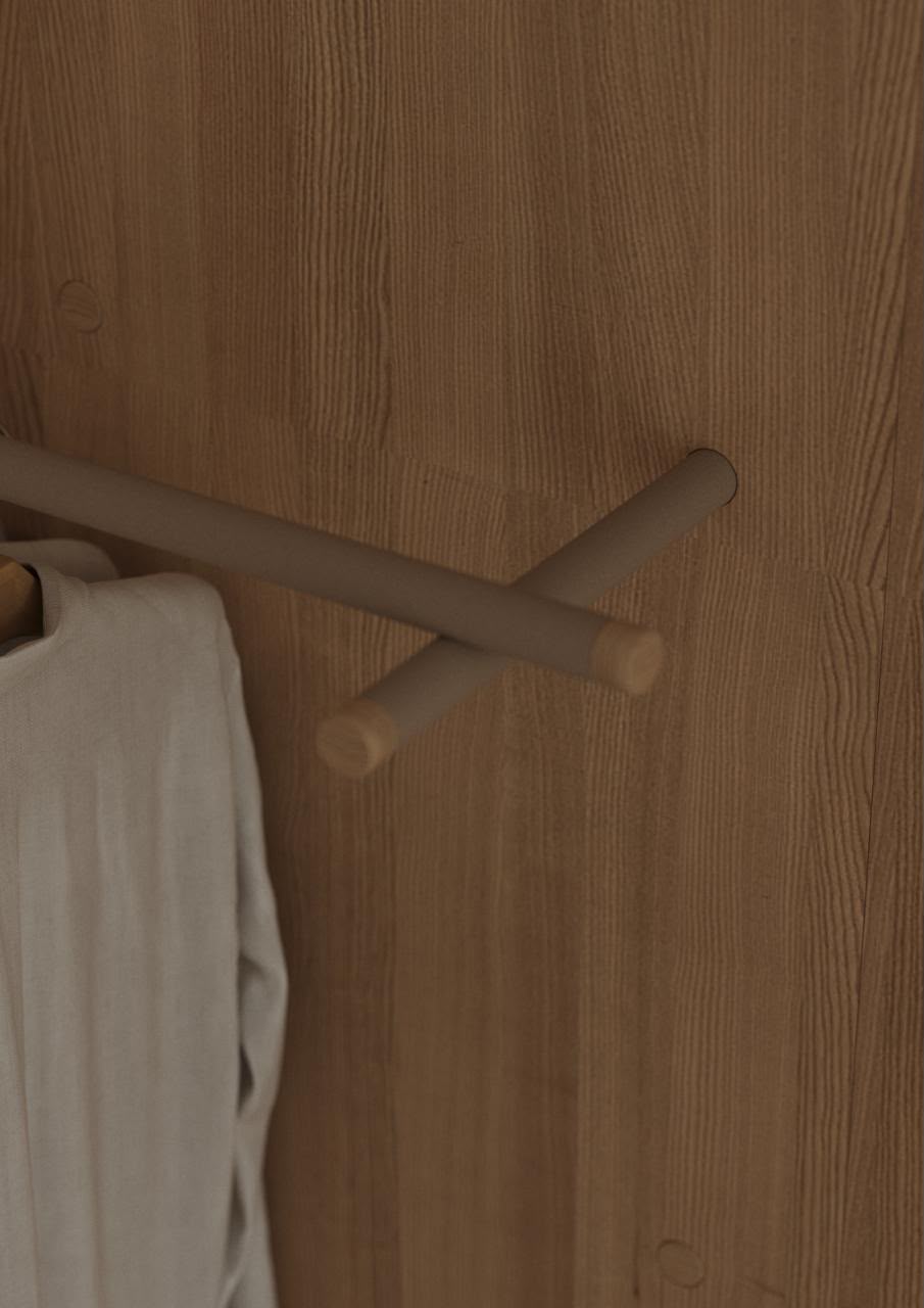 Light wood wardrobe clothes rail detail for student storage