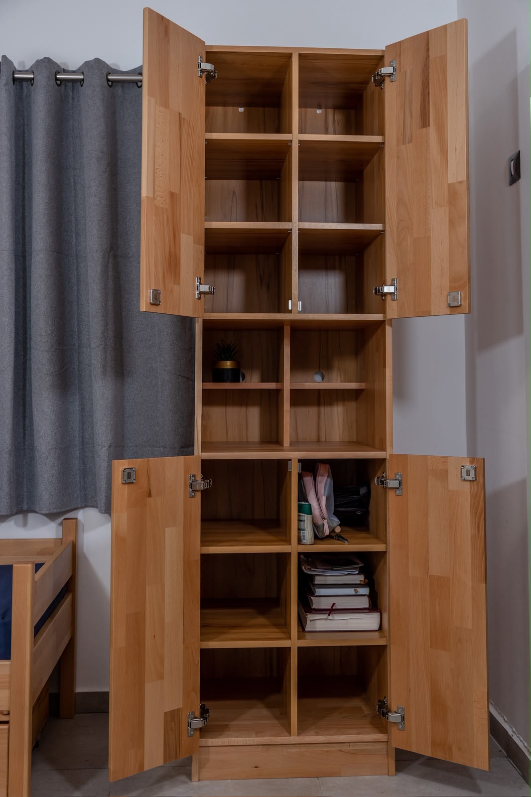 Natural wood wardrobe with open shelving for dormitory storage