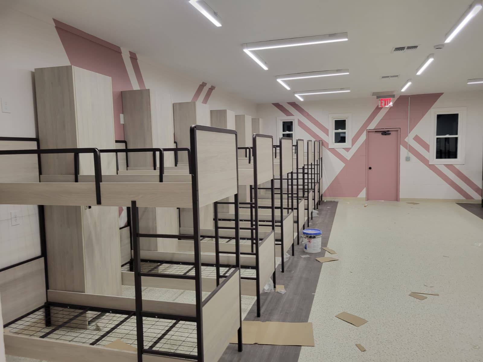 Wide yeshiva dormitory room with two-tone bunk beds